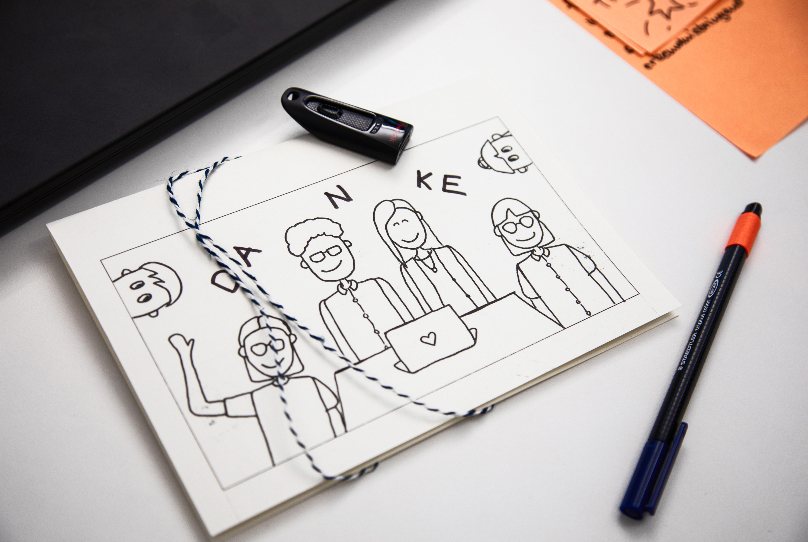 Zettel mit einr Zeichnung, auf der Danke steht